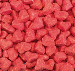 Dulces corazones rojos tiernos